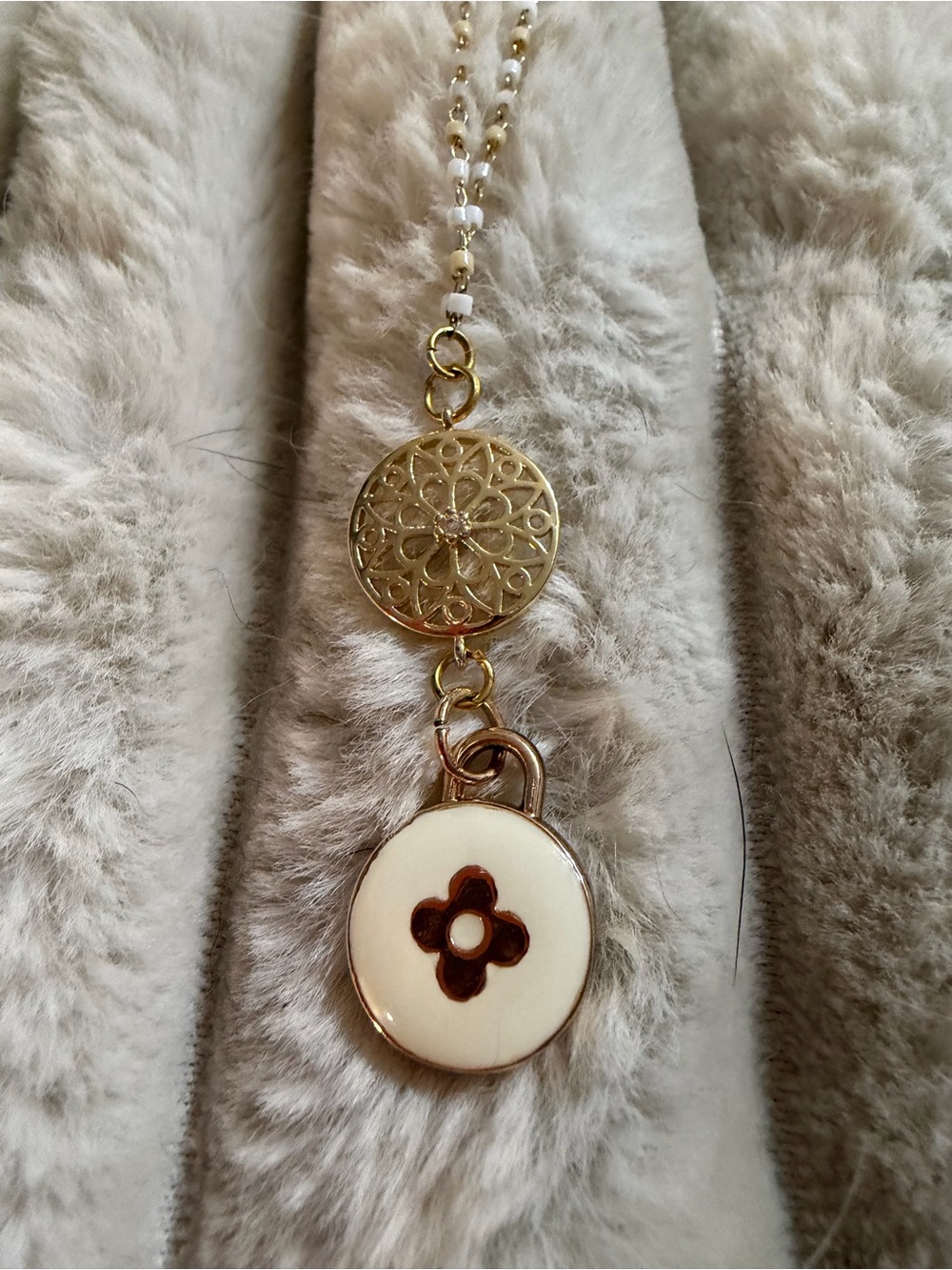 Gold-Tone Pendant Necklace with White Floral Disc